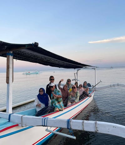 a group of people on a boat in the water at lovina beach