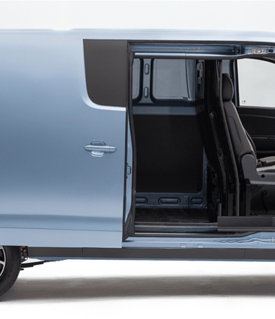 a blue van with a seat and a driver's seat