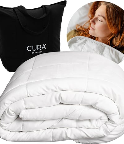 a woman sleeping in a bed with a cura duveted duveted