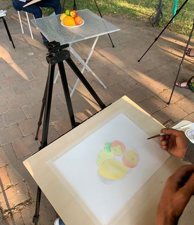 a man is painting a picture of a painting