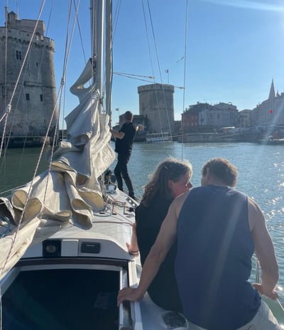 a man and woman sitting on a boat