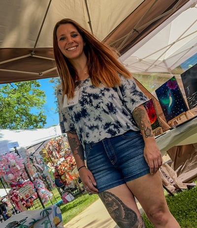 a woman with tattoos on her leggings and a tattoo on her leg