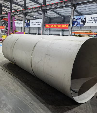 PMI Piping a large pipe pipe pipe in a warehouse