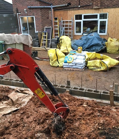 a red excavator with a red excavator on it