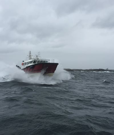 a boat in the ocean with a boat in the water