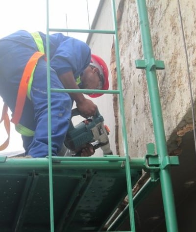 Mechanical stripping of compromised exterior plaster for waterproofing works, Sandhurst Towers, Sandton
