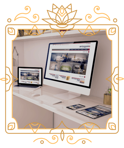 two computers, a phone and an iPad on a desk in a victorian frame