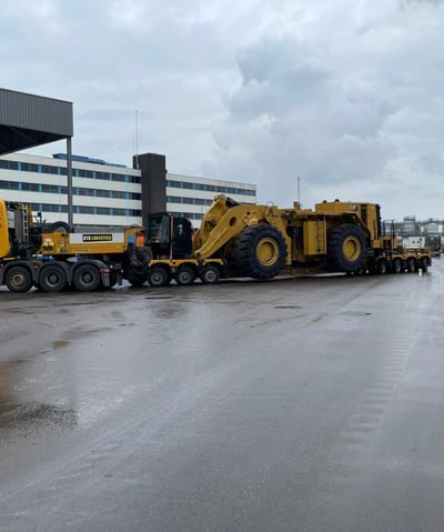 a large truck with a large loader on it