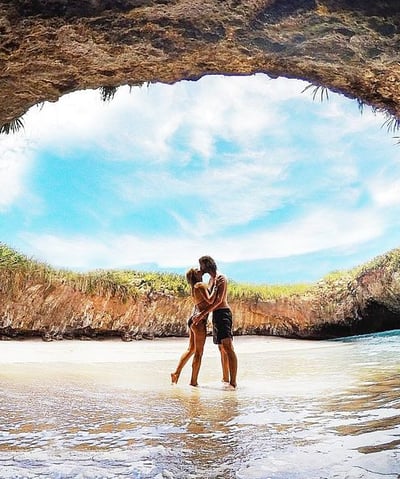 a couple kissing in a cave Marietas