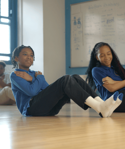 Students doing an abdominal exercise.