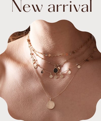 a woman wearing a necklace with a necklace and a necklace