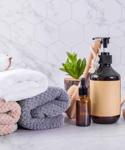 a bathroom with towels, soap, soap, and soap