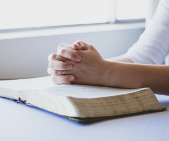 hands joined in prayer -prayers from the church, saints, and scripture