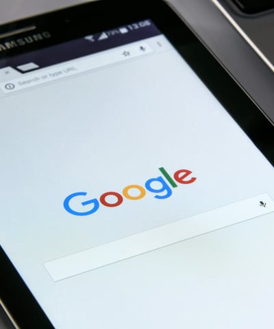 image of a tablet showing google search bar