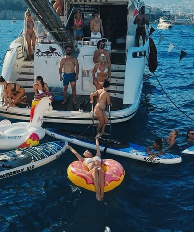 a group of people on a boat in the water