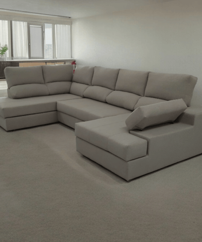 a couch with a large sectional couch in a living room