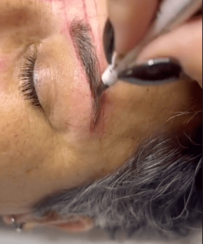 a woman with a black eyeliners and a black eyeliners