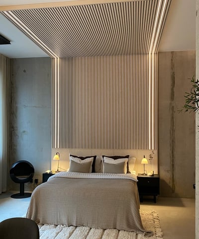 a bedroom with a bed and a chair