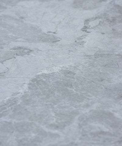 A soft stone slate with intricate gray and silver textures, combining elegance and versatility 