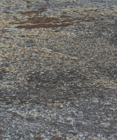 A soft stone slate with a rustic, weathered appearance, adding charm to any design project