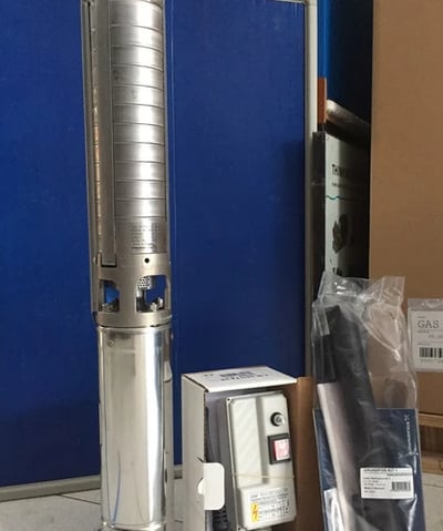 a metal and metal water pump with a blue background