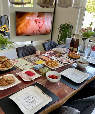 a table with plates of food and drinks