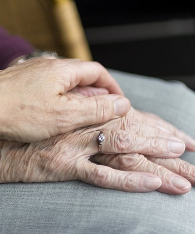 a woman holding a ring on her finger