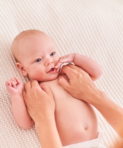 a baby is being held by a woman