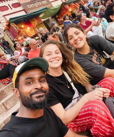 Eva, me, and our local Indian guide on the ghats of Varanasi during a religious ceremony.