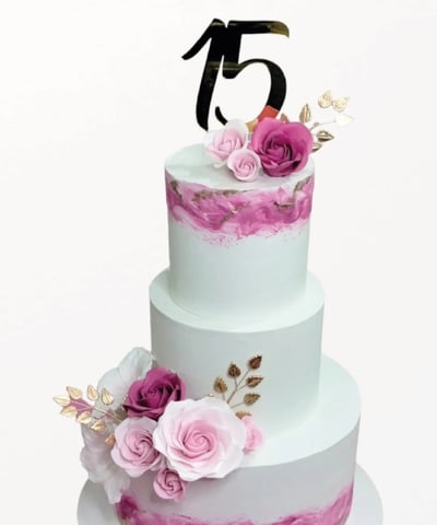 a cake with a number of flowers on it
