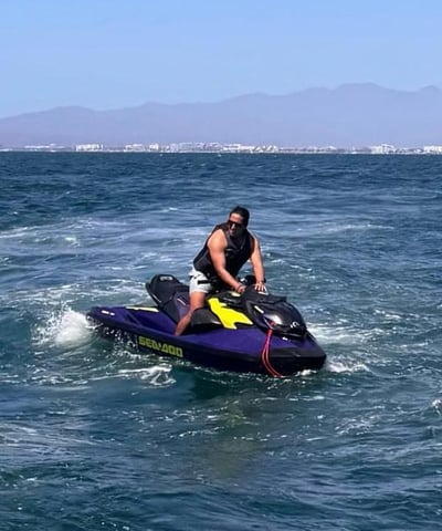 a man riding a jet ski in the ocean