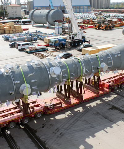 a large pipe - top truck with a large pipe on it