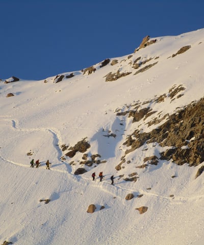 a group of people walking up a snowy mountain - Huayna Potosi in Bolivia