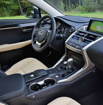 a car dashboard with a steering wheel and dashboard