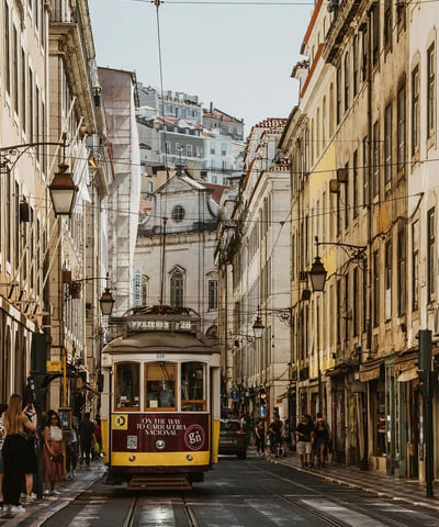 a trolley car on a city street in a city
