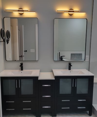 a bathroom with two sinks and mirrors