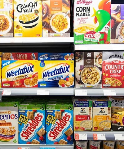 a variety of cereals on display in a store