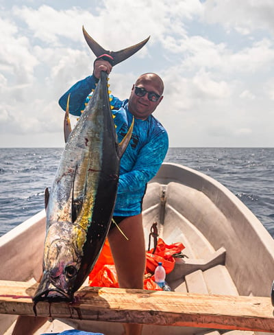 Latham Island Fishing Charters Zanzibar - Excited angler with a Yellowfin Tuna