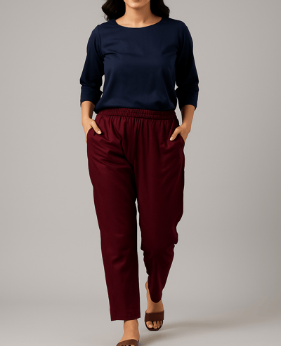 a woman in a blue top and pants with a black top