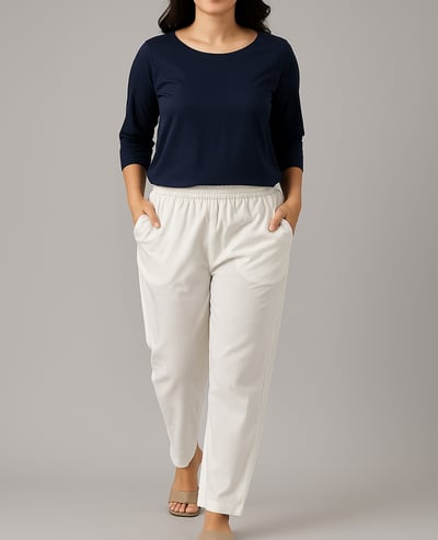 a woman in a blue top and white pants