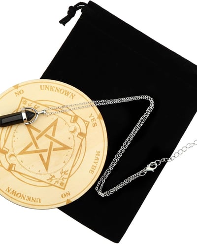 a pentagram and black bag and pendulum