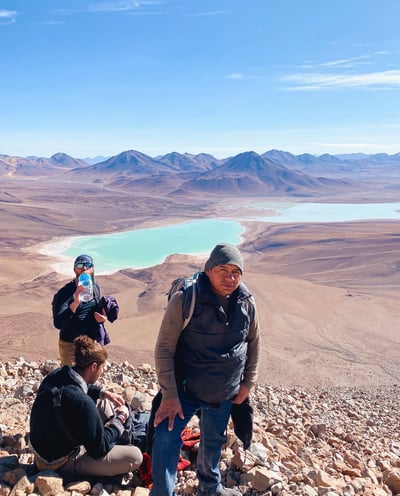Group photo during the ascent of Licancabur volcano with Laguna Verde in the background.