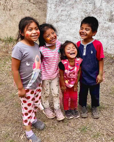 Smiling children photographed in Antigua, Guatemala.