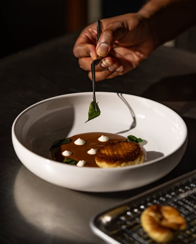 a person is eating a meal in a bowl