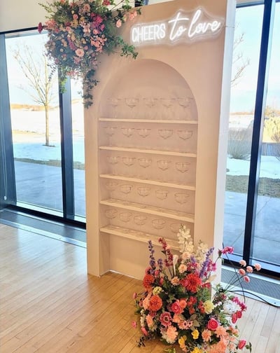 Champagne wall arch with sping flowers, champagne couples and spring flowers 