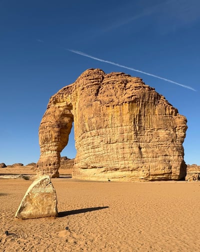Elephant-shaped rock formation in a desert landscape.