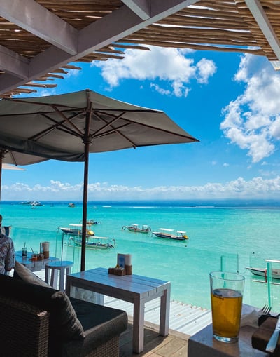 View of the turquoise lagoon waters of Nusa Lembongan from a café terrace.