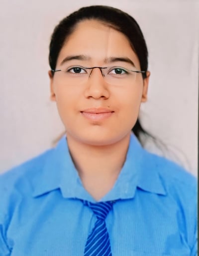 a woman in a blue shirt and tie dye dye dye dye dye dye dye dye