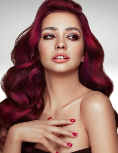 attractive woman with olive skin and burgundy hair after hair coloring