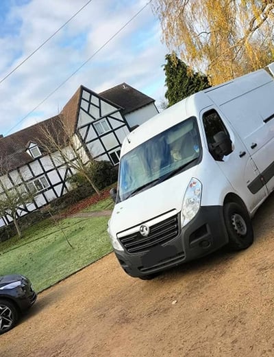mr van business van parked outside a house